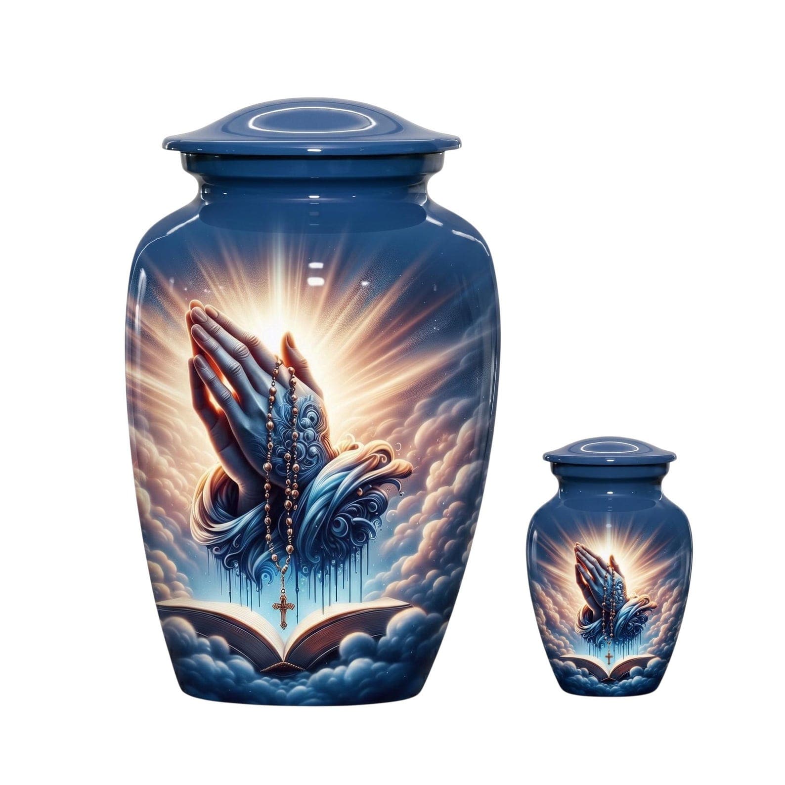 A large and a small blue cremation urn, each featuring a glossy finish and a printed graphic of hands clasped in prayer over an open book, surrounded by clouds and a bright light, with a rosary draped over the hands and 
