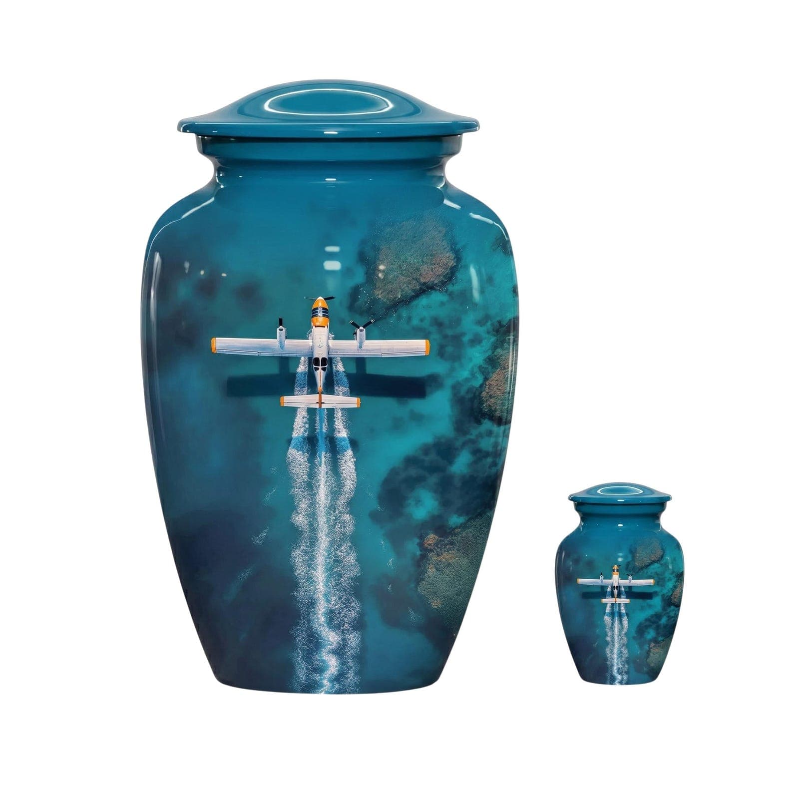 A large and a small teal cremation urn, each featuring a glossy finish with a printed aerial view of a white and yellow airplane flying over deep blue ocean waters, complete with a matching lid on each vessel.